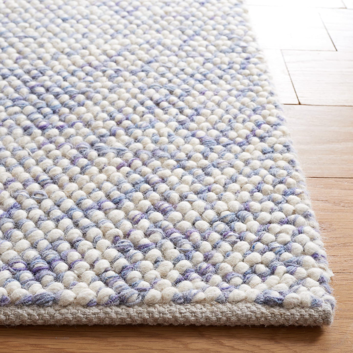 SAFAVIEH Natura Collection Area Rug - 6' x 9', Blue & Ivory, Handmade Wool, Ideal for High Traffic Areas in Living Room, Bedroom (NAT182M)